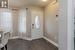 Foyer with a textured ceiling and dark hardwood / wood-style floors