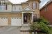 Doorway to property featuring a garage