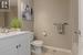 Bathroom featuring tile patterned flooring, vanity, and toilet