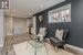 Sitting room with light hardwood / wood-style flooring and beverage cooler