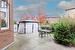 View of patio featuring a storage shed