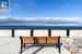 View of patio featuring a water view and a beach view