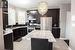 Kitchen featuring appliances with stainless steel finishes, tasteful backsplash, sink, a kitchen island, and hanging light fixtures