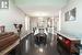 Dining room featuring decorative columns, dark hardwood / wood-style flooring, and an inviting chandelier