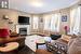 Living room featuring dark hardwood / wood-style floors and plenty of natural light