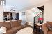 Living room featuring ceiling fan and wood-type flooring