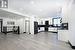 Kitchen with black fridge, decorative backsplash, light hardwood / wood-style floors, range, and extractor fan