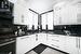 Kitchen featuring white cabinets, sink, stainless steel stove, tasteful backsplash, and extractor fan