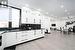 Kitchen featuring dark stone countertops