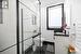 Bathroom with tile patterned flooring, a tile shower, vanity, and toilet