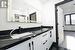 Bathroom with tile patterned floors and vanity