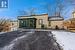 Snow covered property featuring a sunroom