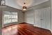 Empty room featuring dark hardwood / wood-style flooring