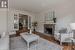 Living room featuring a notable chandelier, hardwood / wood-style flooring, and a fireplace