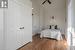 Bedroom featuring a closet, ceiling fan, lofted ceiling, and hardwood / wood-style flooring