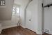 Unfurnished bedroom featuring a closet and dark hardwood / wood-style floors