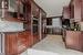 Kitchen with sink, decorative backsplash, and appliances with stainless steel finishes