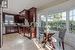 Kitchen featuring sink, plenty of natural light, tasteful backsplash, and dark stone counters