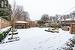 Yard covered in snow featuring a hot tub and a gazebo