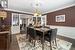 Dining space featuring ornamental molding, hardwood floors and french doors