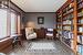 Sitting room featuring built-in bookcase, wainscotting and hardwood flooring