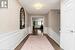 Upper level hallway with hardwood flooring