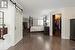 Primary bedroom with walk-in closet, hardwood flooring and bonus sitting room