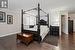 Primary Bedroom with crown molding and hardwood flooring