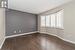 Upper level bedroom with hardwood flooring and closet