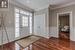 Entrance foyer featuring crown molding and dark hardwood / wood-style floors