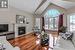 Living room featuring wood-type flooring and vaulted ceiling