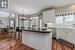 Kitchen featuring sink, a center island, stainless steel dishwasher, and white cabinets