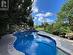 View of pool featuring a lawn and a patio area