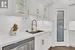 Kitchen featuring sink, white cabinets, stainless steel dishwasher, and dark hardwood / wood-style floors