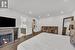 Bedroom featuring dark wood-type flooring and ensuite bath