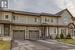 Townhome / multi-family property featuring a garage