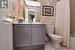 Bathroom with shower / bath combination with curtain, tile patterned flooring, vanity, and wallpapered walls