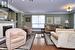 Living area featuring a tile fireplace, dark wood-type flooring, baseboards, built in features, and ornamental molding