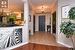 Foyer featuring a chandelier, ornamental molding, light wood finished floors, and baseboards