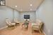 Living area featuring light wood-type flooring, baseboards, and recessed lighting