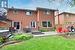 Back of property with a patio, brick siding, fence, a lawn, and a pergola