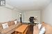 Living room with french doors, dark wood-style flooring, crown molding, a textured ceiling, and baseboards