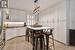 Revamped Kitchen with Pristine Quartz Surfaces and an Oversized Pantry