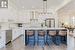 Chef's Kitchen Boasts High-Gloss White Cabinetry with Pull-Out Drawers