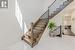 Ascend the Hardwood Staircase with Wrought Iron Pickets to the Upper Level