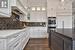 Quartz Countertops and Top-Of-The-Line Appliances in Kitchen