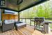 Covered Deck with Glass Panels and Overhead Ceiling Fan
