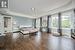 Expansive Primary Bedroom with a Coffered Ceiling and Walk-In Closet