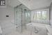 Lavish Primary Ensuite with a Luxurious Airtub and Steam Shower