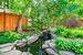 Beautiful Perennial Gardens, Concrete Patio, Pond with Waterfall